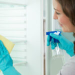 Female Cleaning Fridge