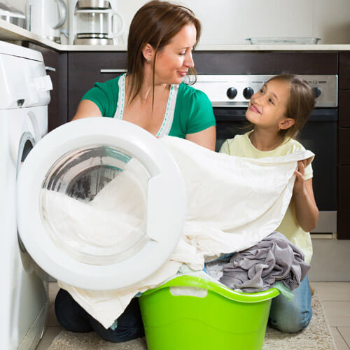 Woman Doing Laundry With Daughter