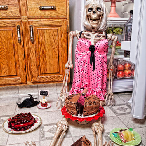 Female Skeleton Eating Cake From Fridge