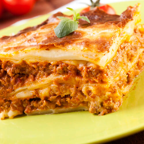 Close Up Lasagne On Green Plate