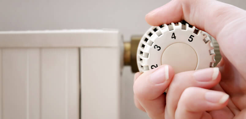 Hand Turning Down A Radiator