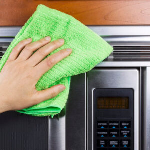 Hand Wiping Microwave With Cloth