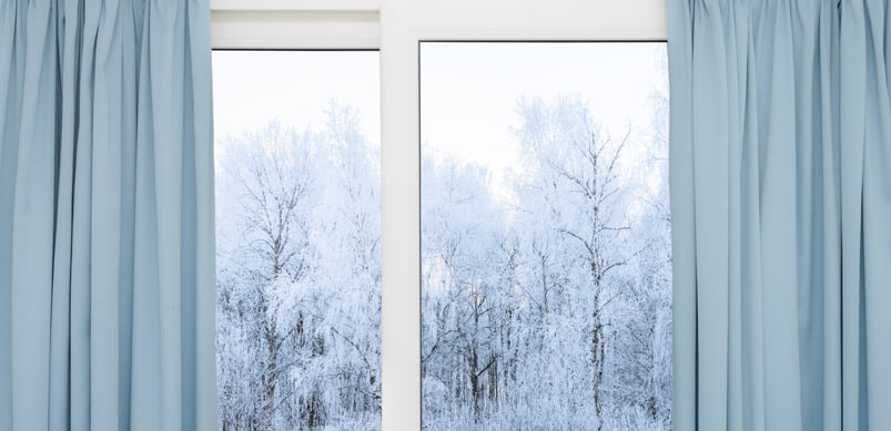 Open Curtains With Frosty Trees Outside