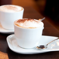 Two Cappuccinos On Table