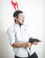 Man Holding A Drill Wearing Antlers