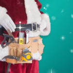 Santa Wearing a Toolbelt To Fix His Appliance