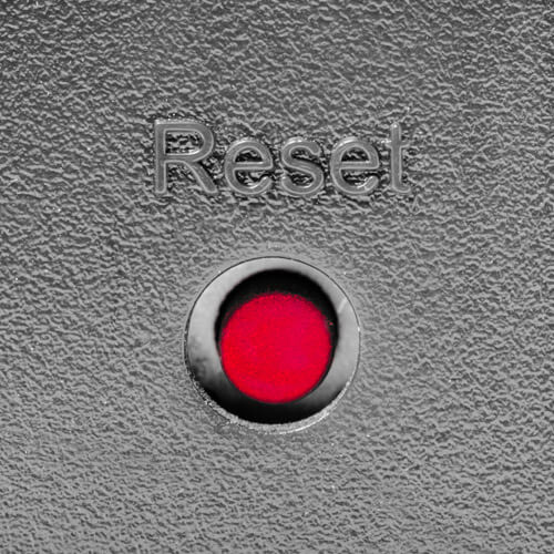 Red Reset Button On Silver Background