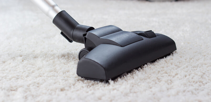 Vacuum Cleaner On White Carpet