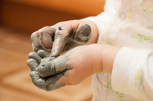 Child Playing With Clay