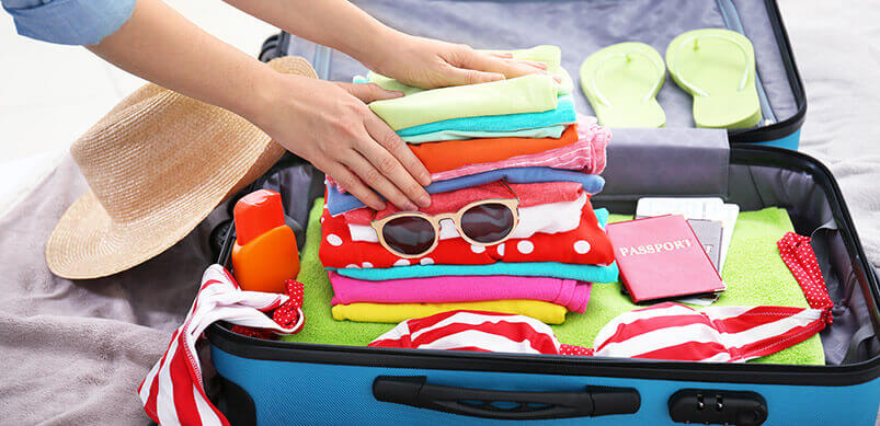 Person-Packing-A-Holiday-Suitcase