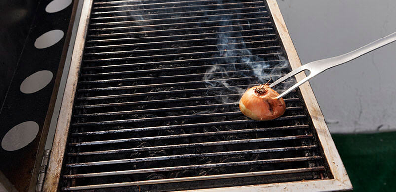 Cut Onion On BBQ Grill