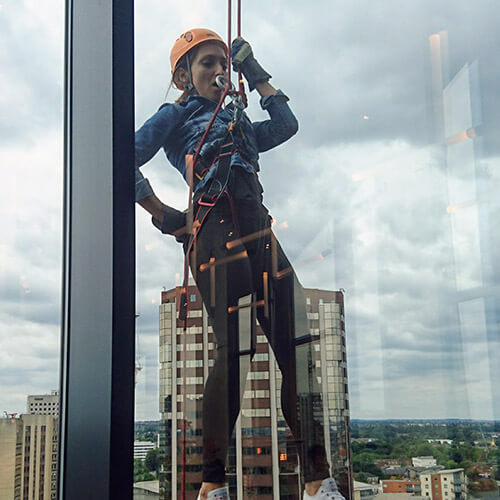 Mariya Abseiling Down Window