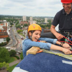 Mariya Hanging Over Building Looking Scared