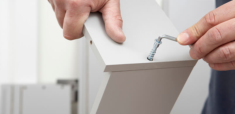 Person Putting Together Flat Pack Furniture