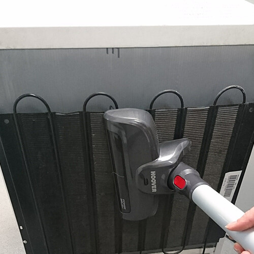 Vacuuming Fridge Condenser Coils