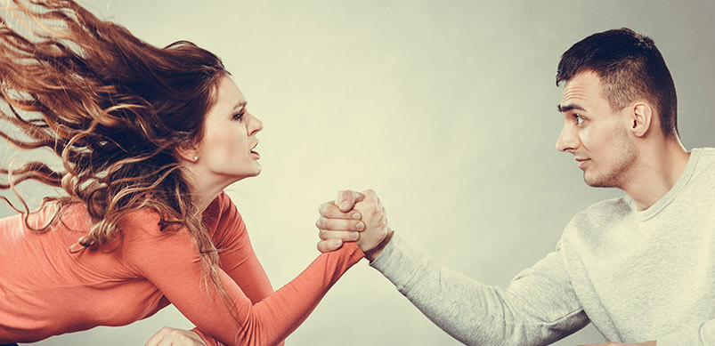 Woman And Man Arm Wrestling