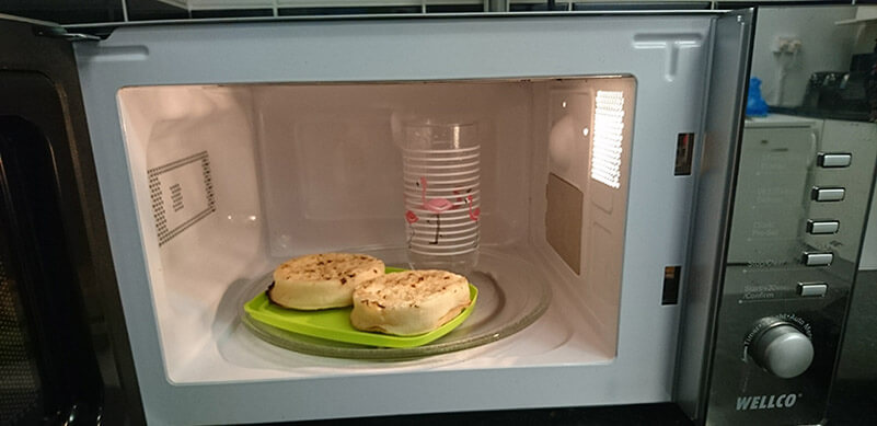 Crumpets In Microwave With Water In Glass