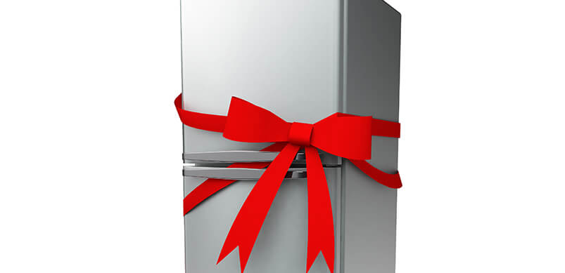 Silver Fridge With Red Bow Wrapped Around