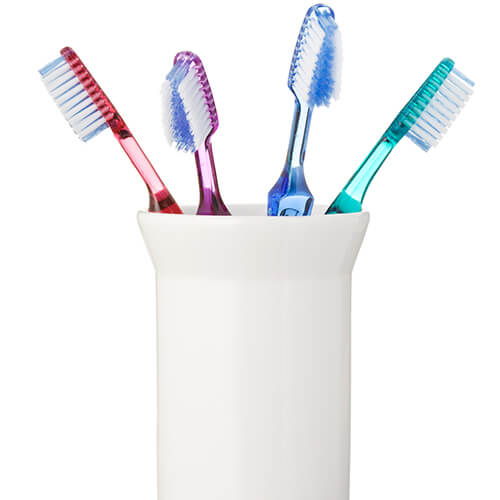 Coloured Toothbrushes In White Holder 