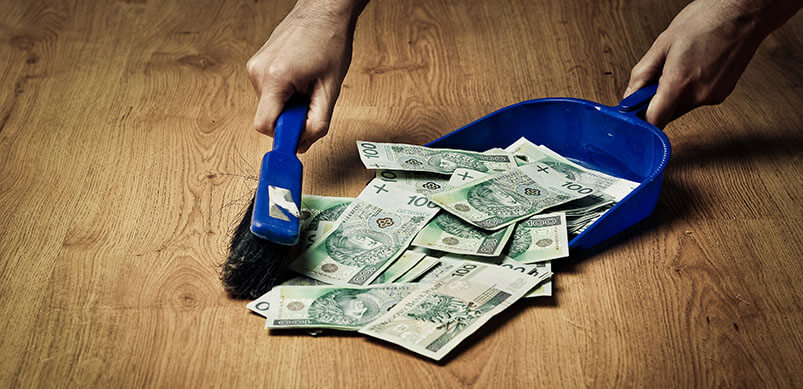 Sweeping Money With Dustpan And Brush