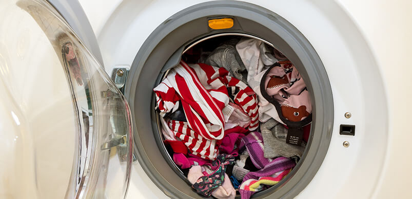 Washing Machine Full of Clothing