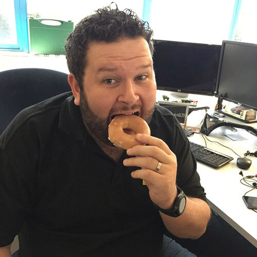 Adam Enjoying His Doughnut