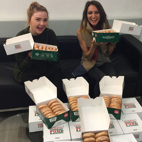 Mariya and Kat With Boxes Full Of Doughnuts