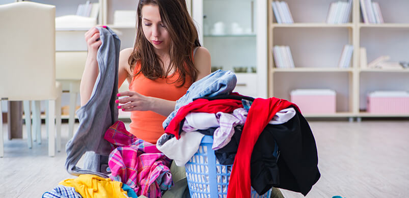 Woman Sorting Laundry From Basket