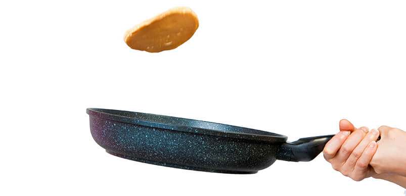 Frying Pan With Pancake Flipping In Air