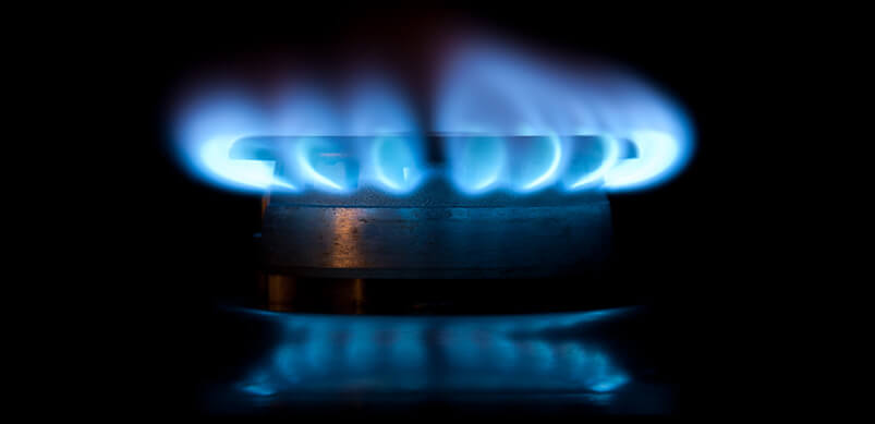 Gas Ring With Blue Flames On Black Background