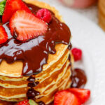 Stack Of Pancakes With Chocolate And Strawberries