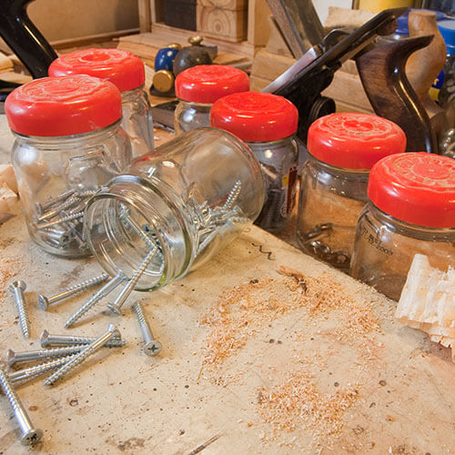 Jars Of Screws On Workbench