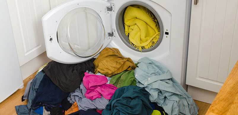 Washing Machine Door Open With Clothes Coming Out