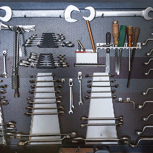 Work Tools Hanging On Pin Board