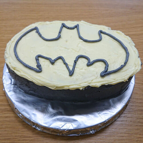 Chocolate Cakw With Batman Logo On Icing