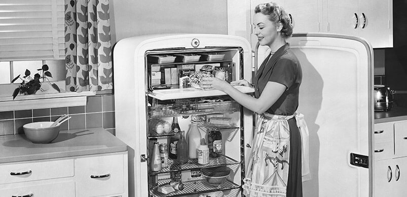 Black And White Image Of Woman And Vintage Fridge