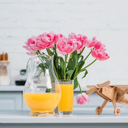 Pink Flowers On Kitchen Shelf