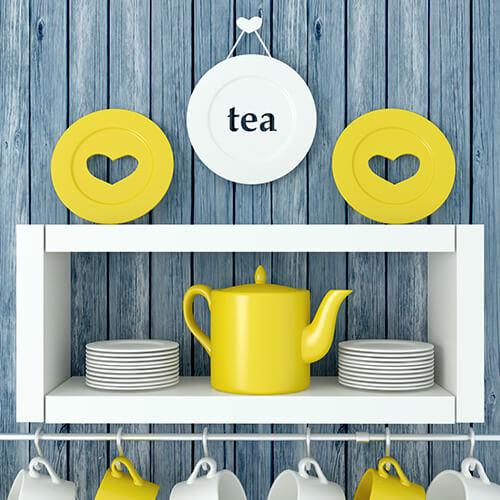 White and Yellow Cups And Plates On Shelves