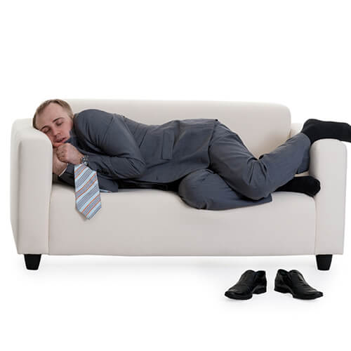 Man Sleeping On A Sofa