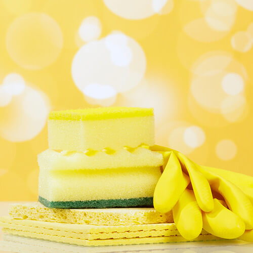 Kitchen Sponge On Yellow Background