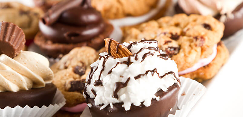 Row Of Cupcakes Topped With Chocolate