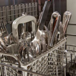 Close Up On Cutlery Inside Dishwasher