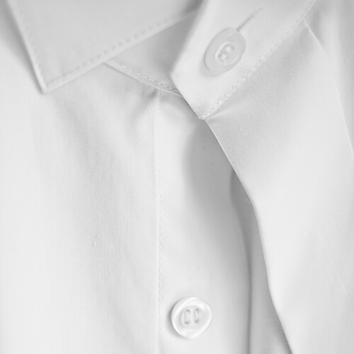 Close Up On White Shirt Buttons