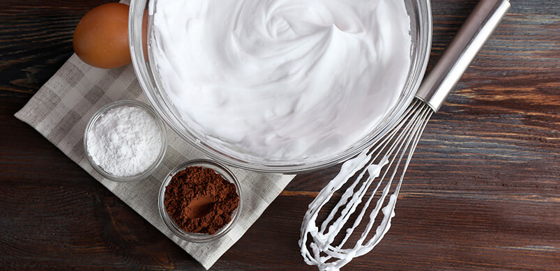 Whipped Cream Inside Bowl With Whisk