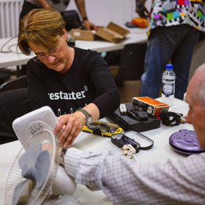 Woman From Restart Project Fixing Fan