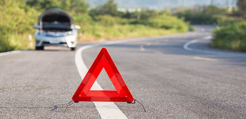 Red Emergency Road Sign With Car Broken Down