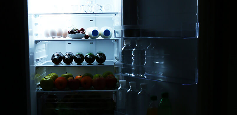 Dark Refrigerator With Light Inside 