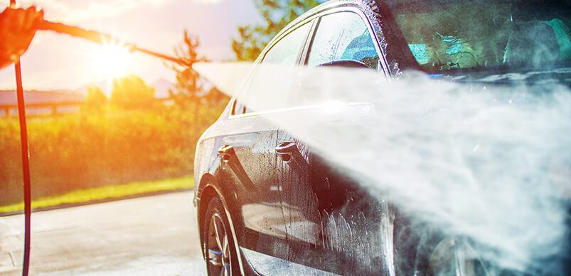 Car Being Washing With Pressure Washer 