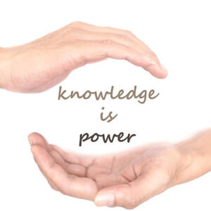 Words 'Knowledge Is Power' Held In Hands