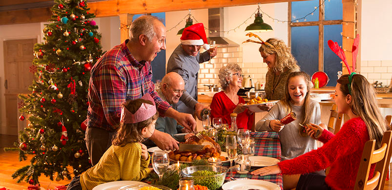 Family Laughing During Christmas Dinner